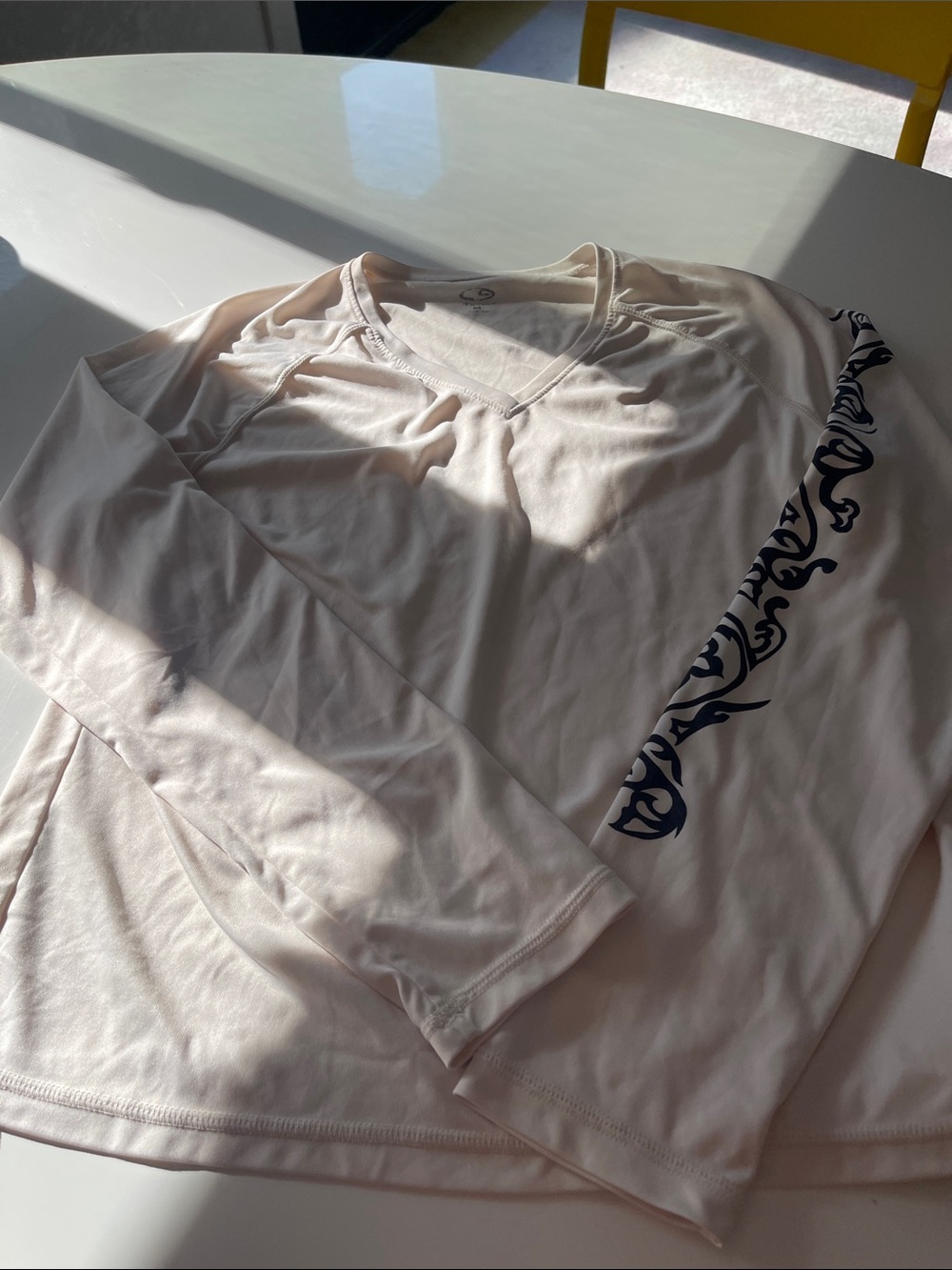 CreamLong Sleeve Active Wear Top with black Graphic Sleeve